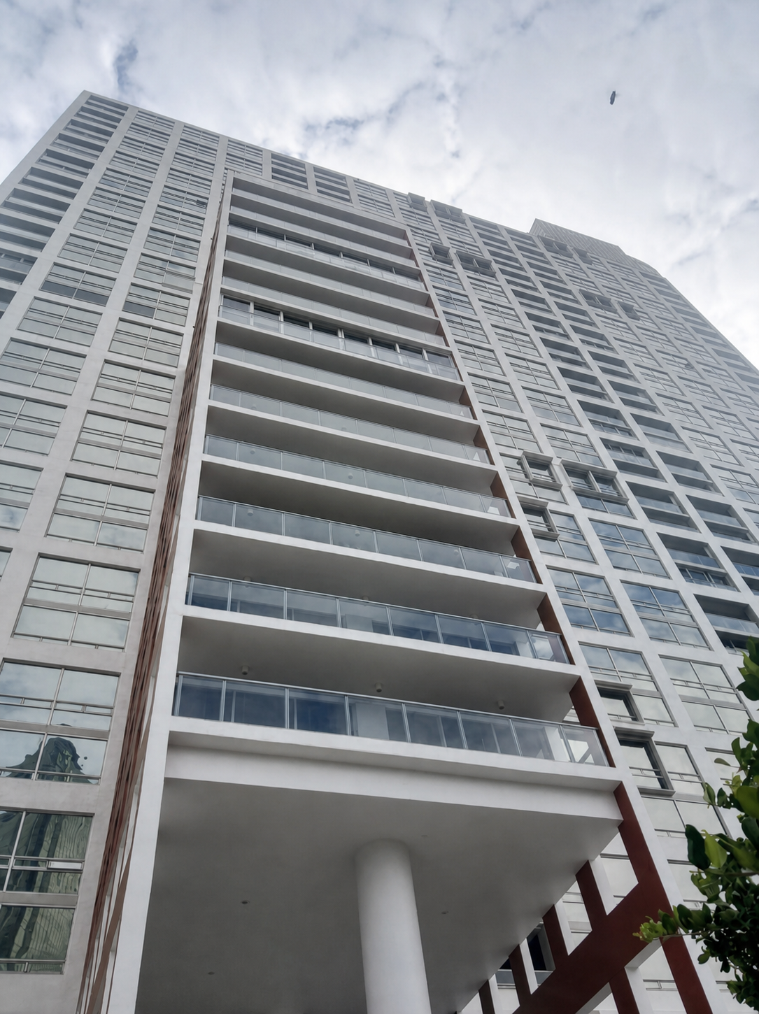 The Palace tower exterior with balcony railings in Brickell, Miami